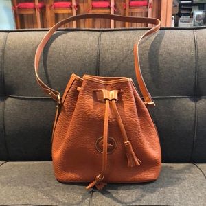Dooney & Bourke all leather, rust/saddle color, bucket,  shoulder bag.  Not worn